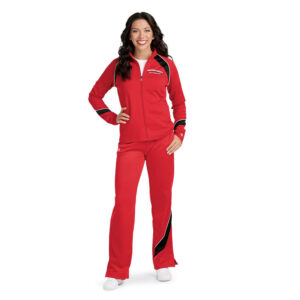 Smiling model standing in Champion Nova Warm Up Pants with coordinating jacket, front view