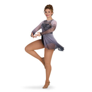 Custom skirted leotard with printed lace overlay, front left three-quarters view in motion
