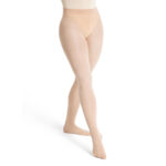 Model wearing natural capezio ultra soft transition tights, front three-quarters view