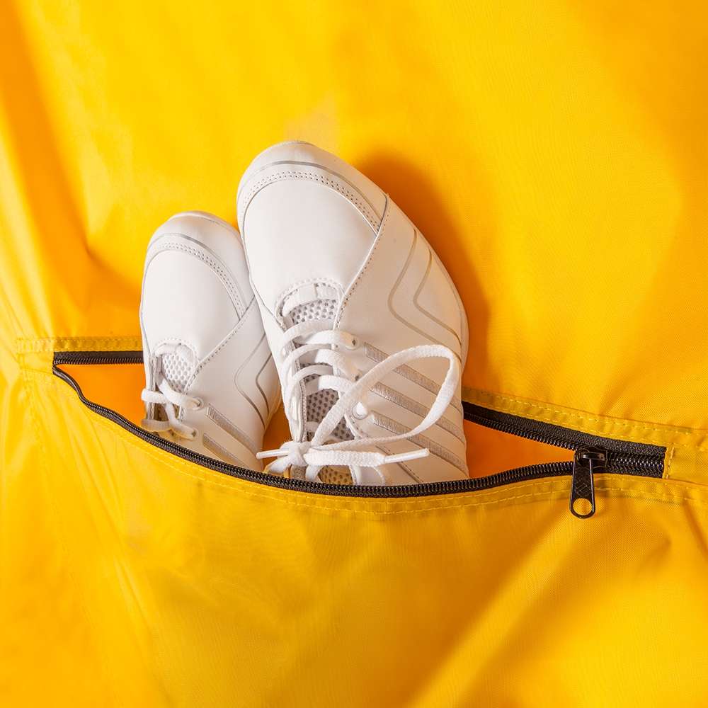 Gold Deluxe Garment Bag with black zipper, back detail view with cheer shoes in shoe pocket