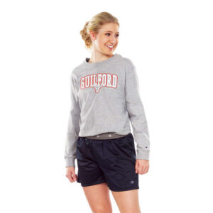 model posing in navy Champion Essential Short, front view