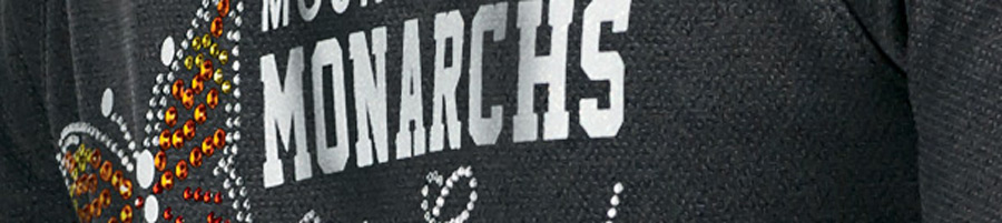 rhinestone and glitter design on a black cheerleading jersey