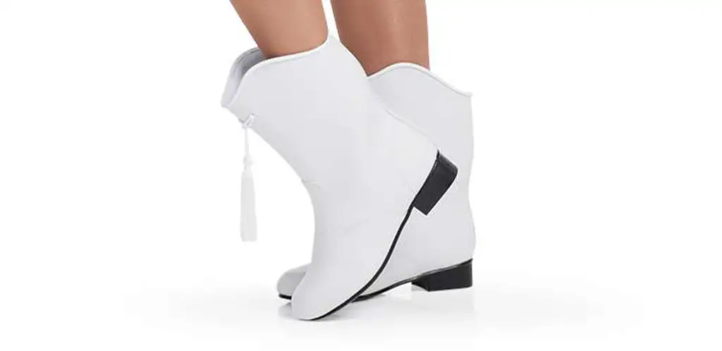 cropped image of twirler wearing majorette boots