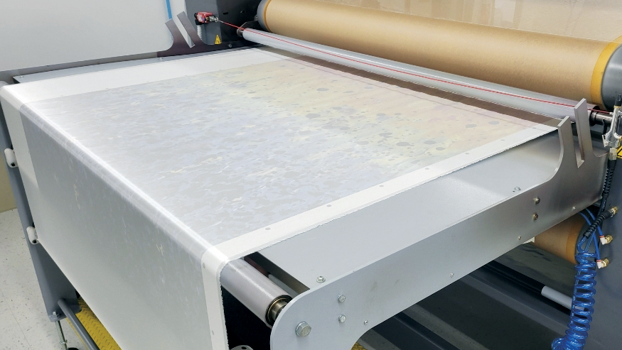 heat press machine pressing a design into fabric